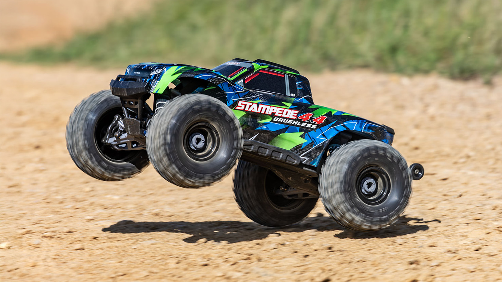 Traxxas Stampede 4X4 launching over rough dirt
